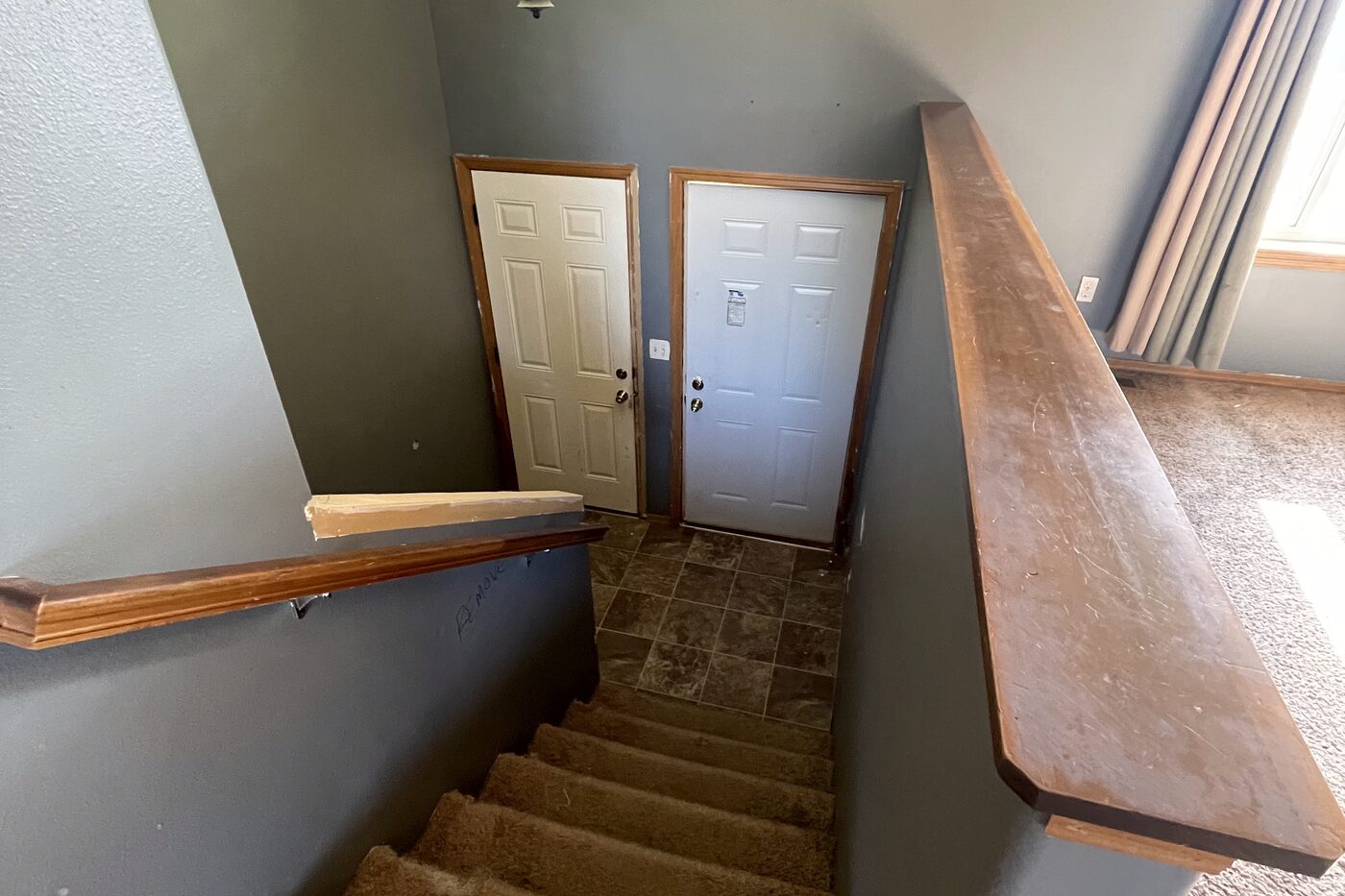Entry and stairs before All Things Home worked on it
