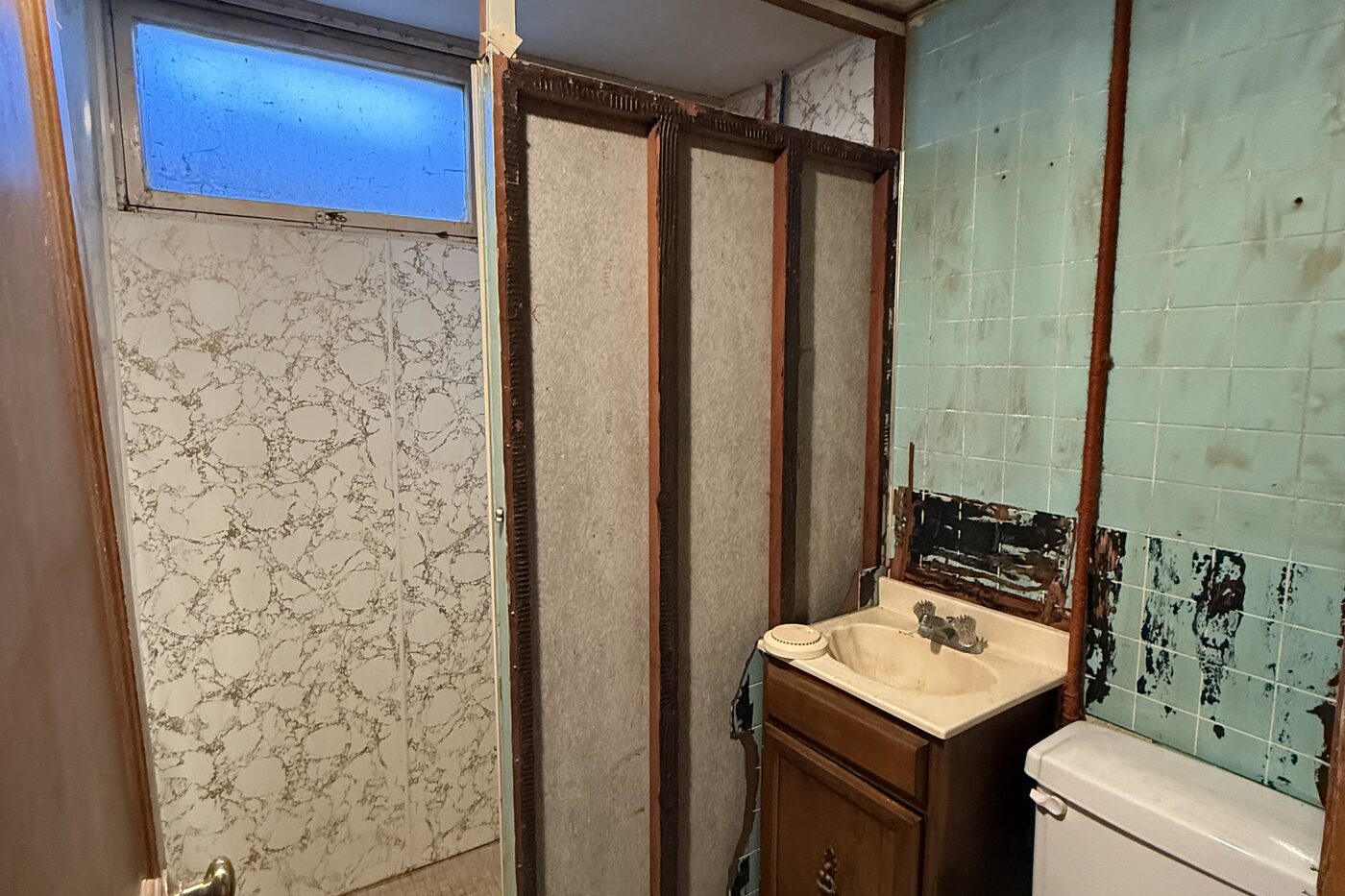 Bathroom before All Things Home worked on it