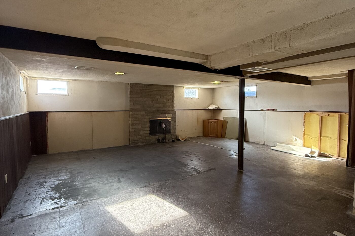 Lower level before All Things Home worked on it