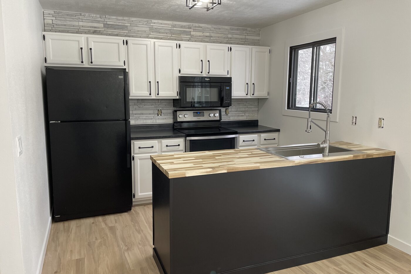 A kitchen in a house we bought full of belongings after the work was done